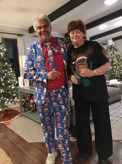 Team members in novelty Christmas outfits