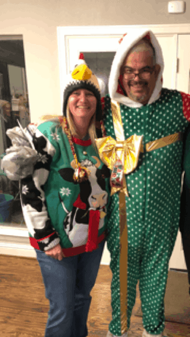 Team members in novelty Christmas costumes