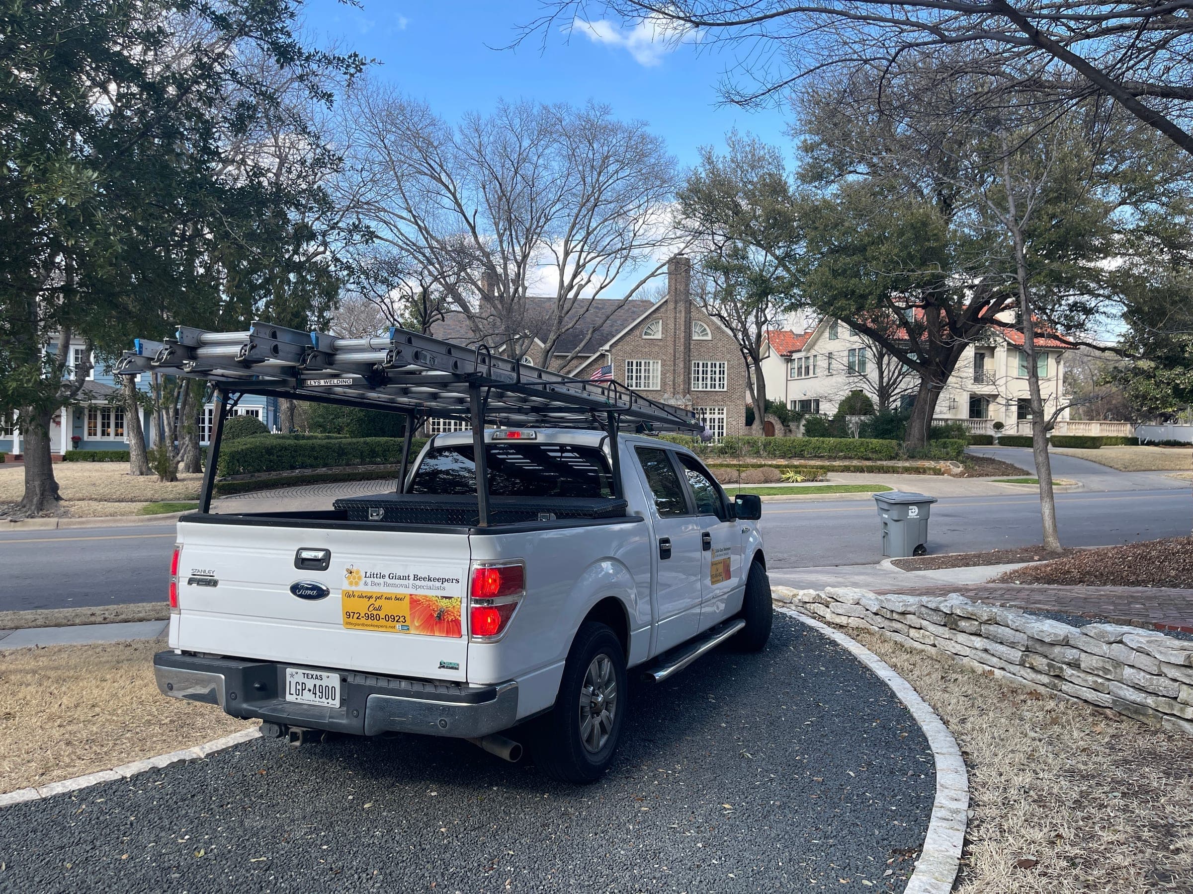 Little Giant Beekeepers truck parked on a suburban street